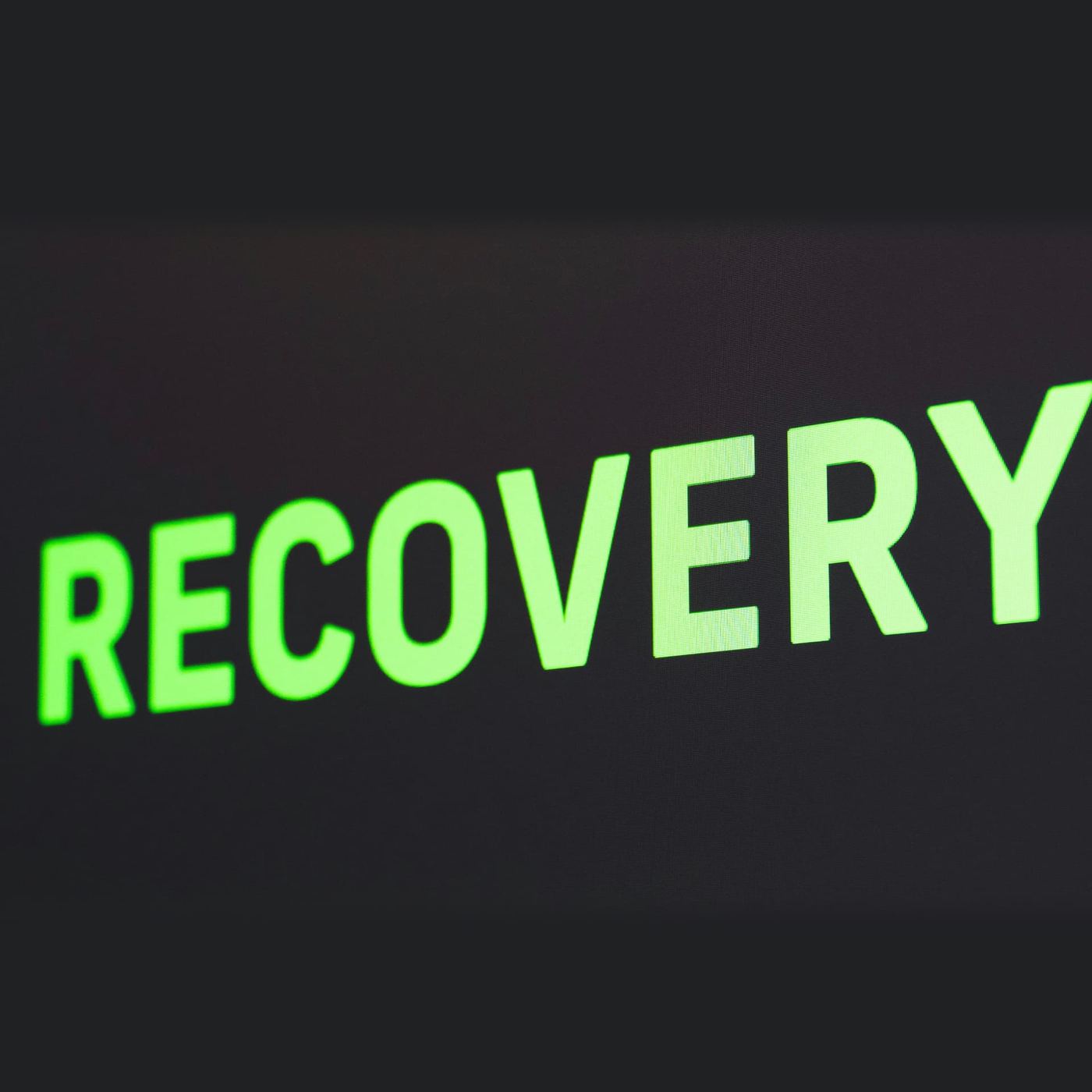 The word 'Recovery' shown in bright green letters on a dark screen
